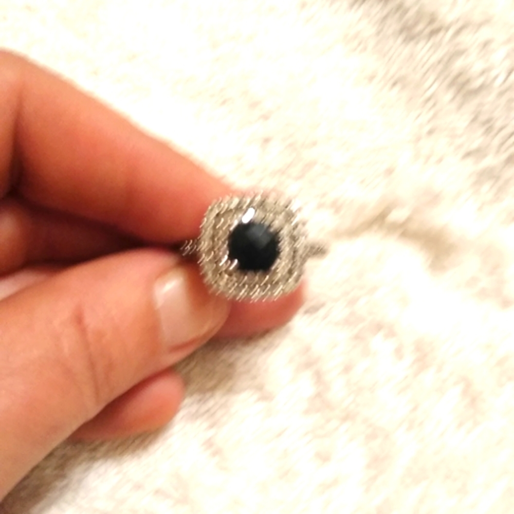 Beautiful black diamond ring with two halos of white diamonds
